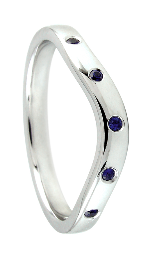 White gold wedding band flush set with round brilliant cut sapphires