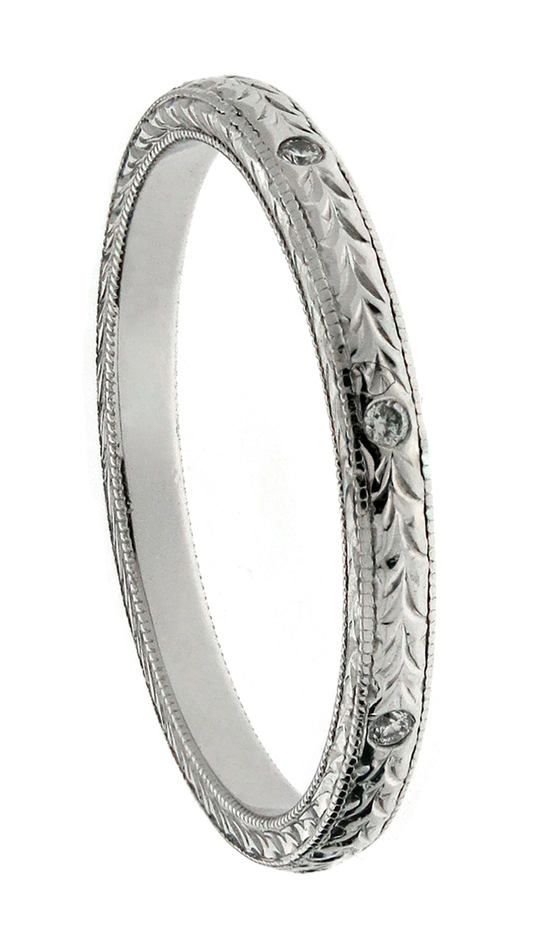 Hand engraved wedding band with flush set diamonds
