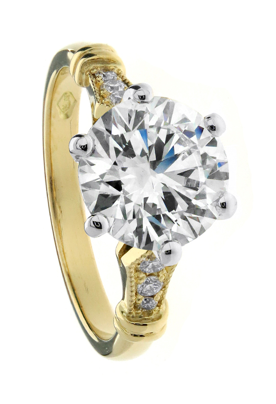 Yellow Gold diamond solitaire engagement ring with tapered pavé shoulders