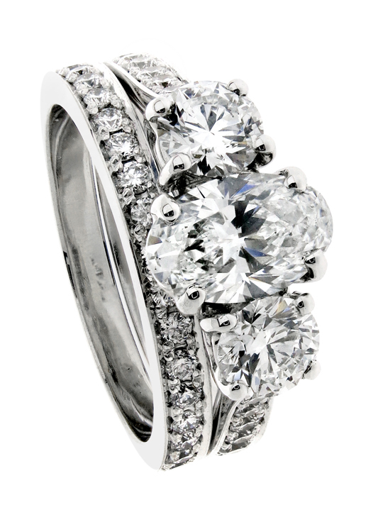 Oval diamond and side round brilliant Trilogy Engagement ring with Pavé wedding band