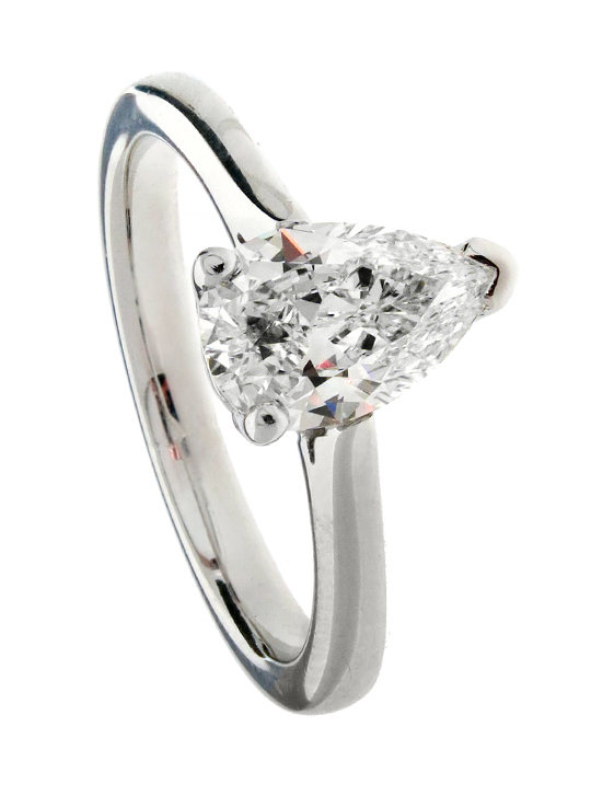 Pear cut diamond engagement ring on white gold wedding band.