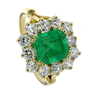 Green emerald and antique old european cut diamond halo in 18ct yellow gold ring